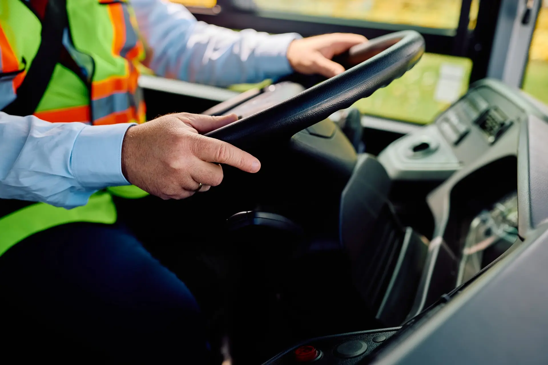 Close up of school bus driver driving a bus.